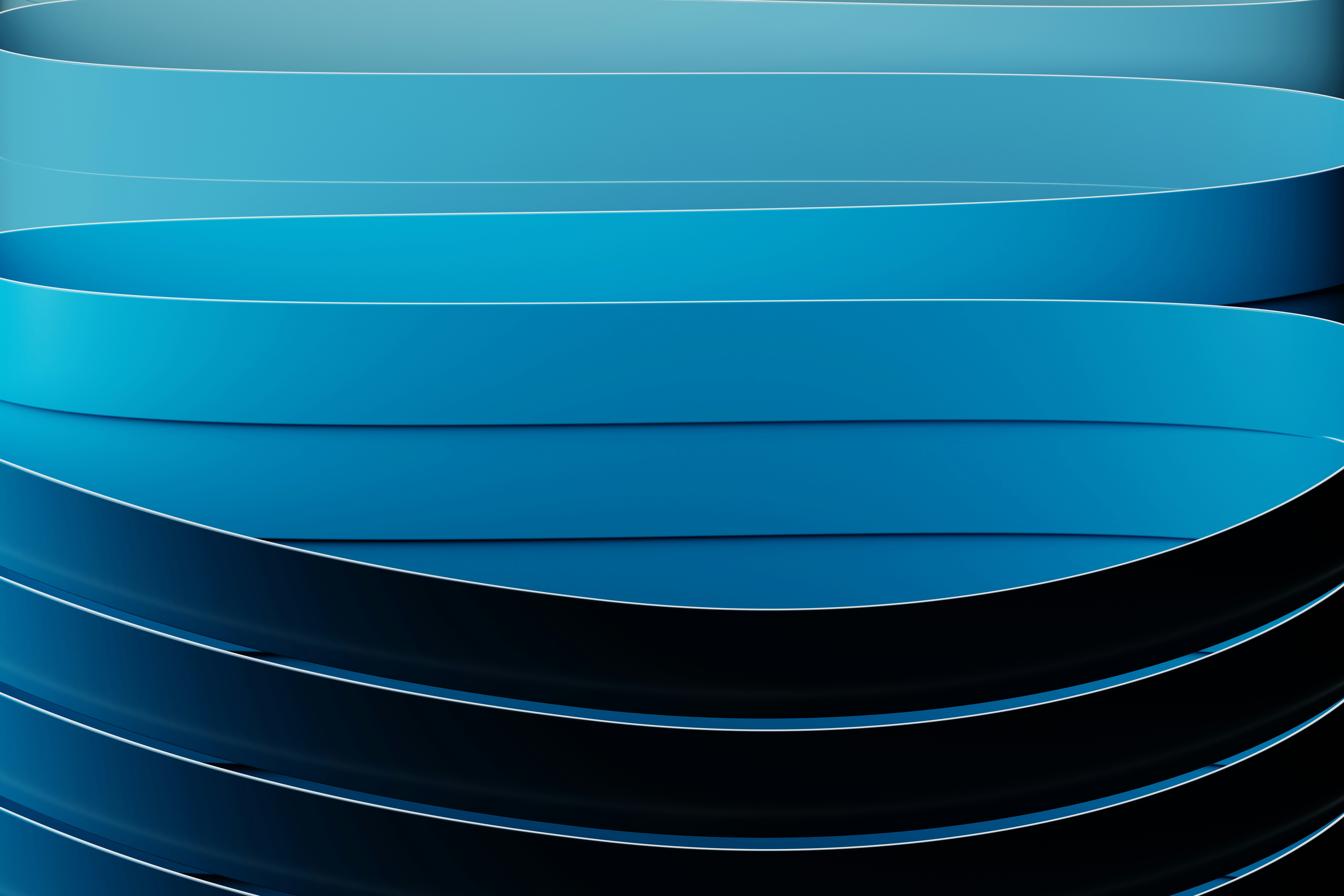 Abstract blue and black ribbons create a swirling design.