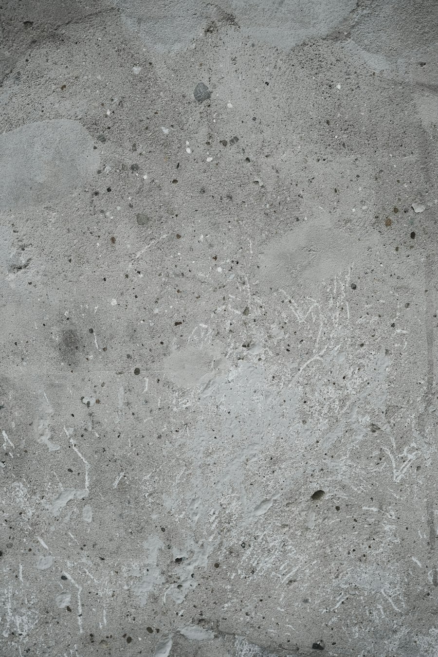 Betonoberfläche mit feiner, unregelmäßiger Textur in Grau