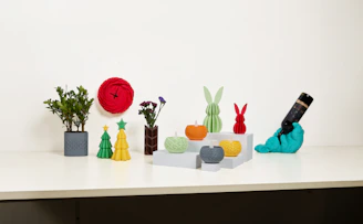 Several colorful decorations are displayed on a counter.