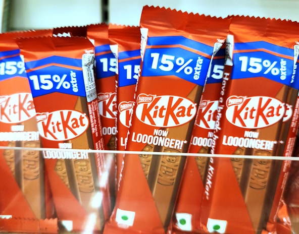 Kit kat chocolate bars are displayed for sale.