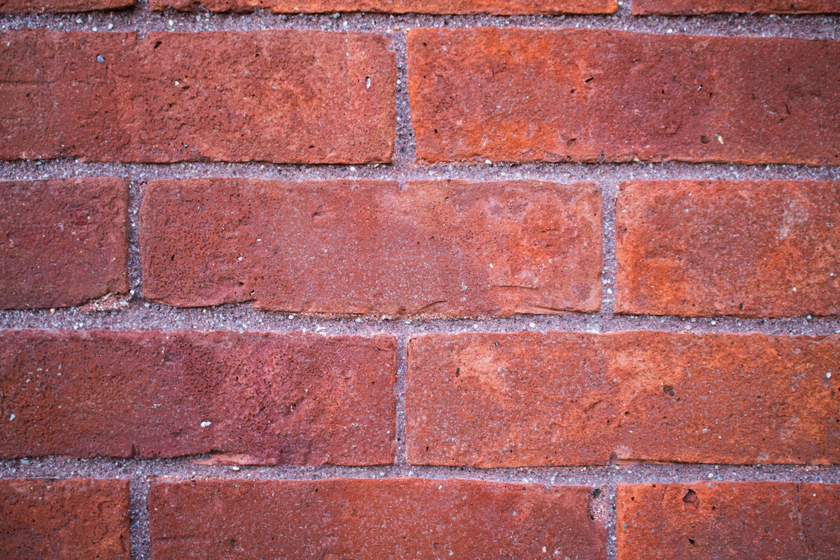 A close-up of a red brick wall.