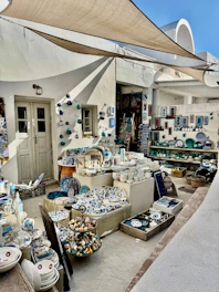 A shop displays ceramics and souvenirs in greece.