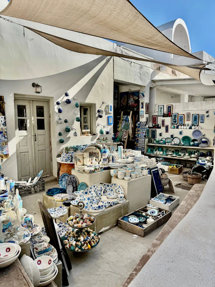 A shop displays ceramics and souvenirs in greece.