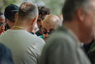 People are gathered and looking towards the camera