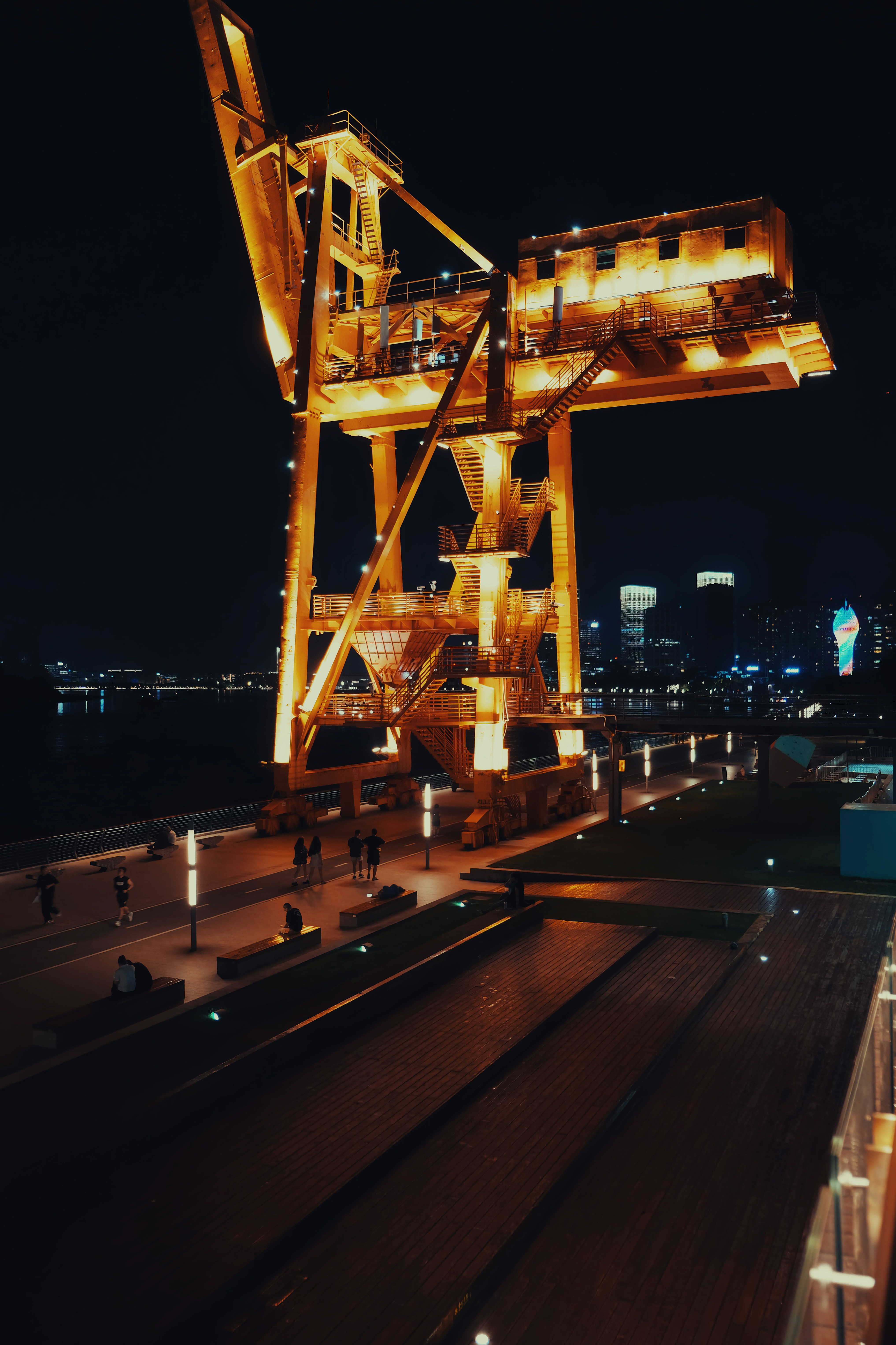 Illuminated crane at night.
