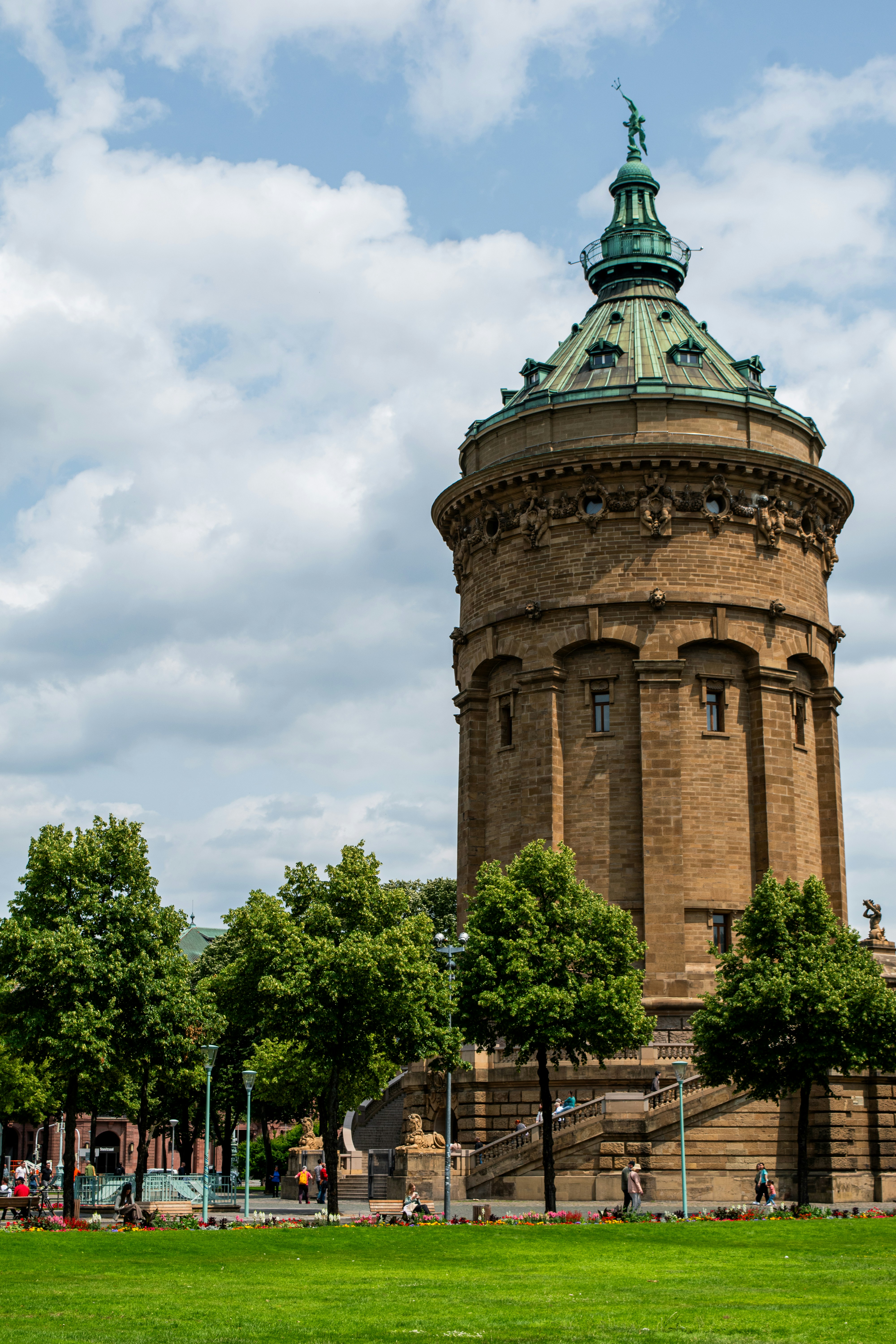 A tall, stone tower stands beneath a cloudy sky.
