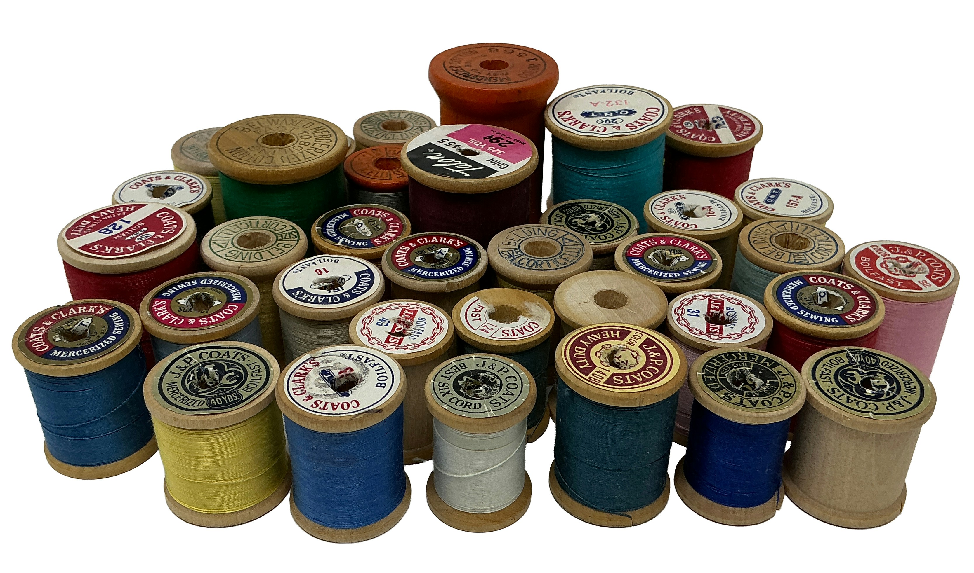 A pile of vintage thread spools.