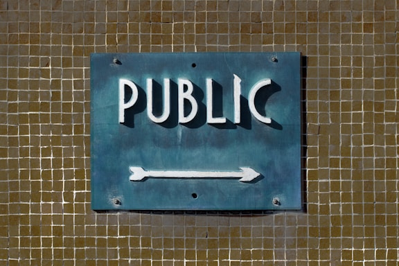 Public sign points to something.
