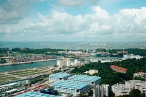 Aerial view of a coastal city with a harbor.