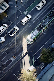 A tram travels down a city street.