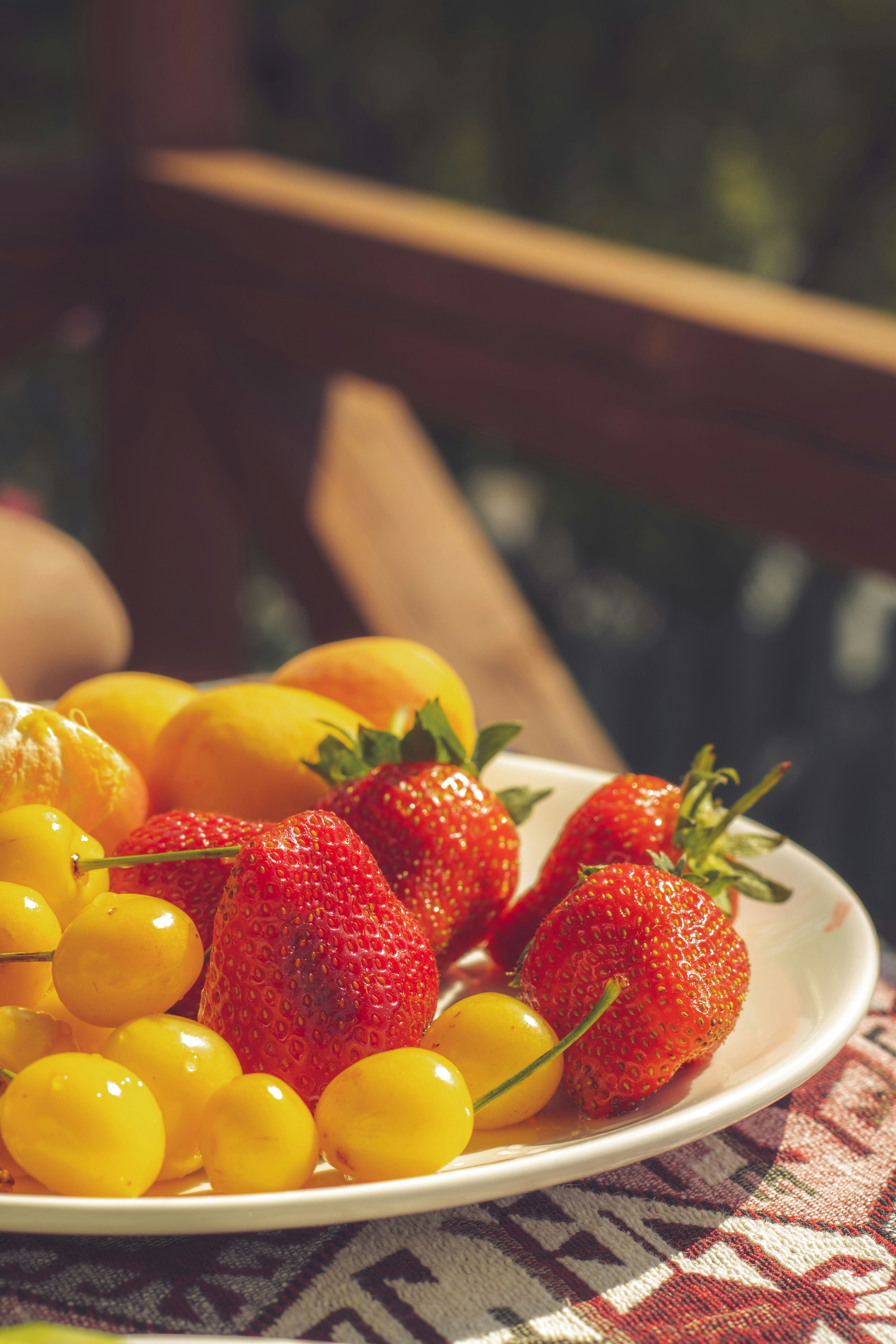 A plate of fresh, vibrant summer fruit.