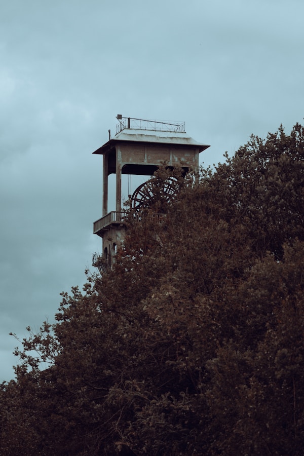 Mine shaft tower in natural landscape