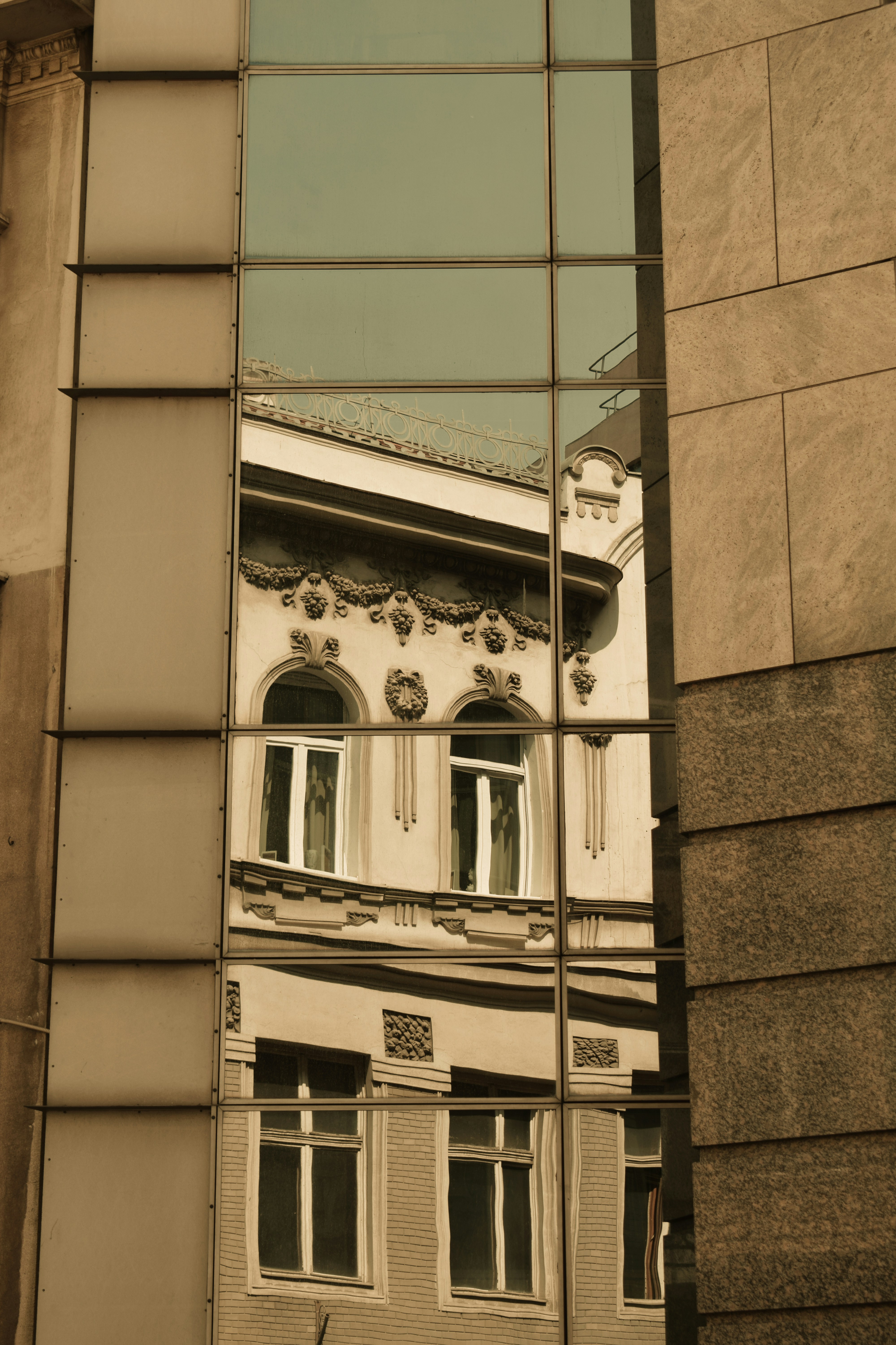Building reflected in a mirrored window.
