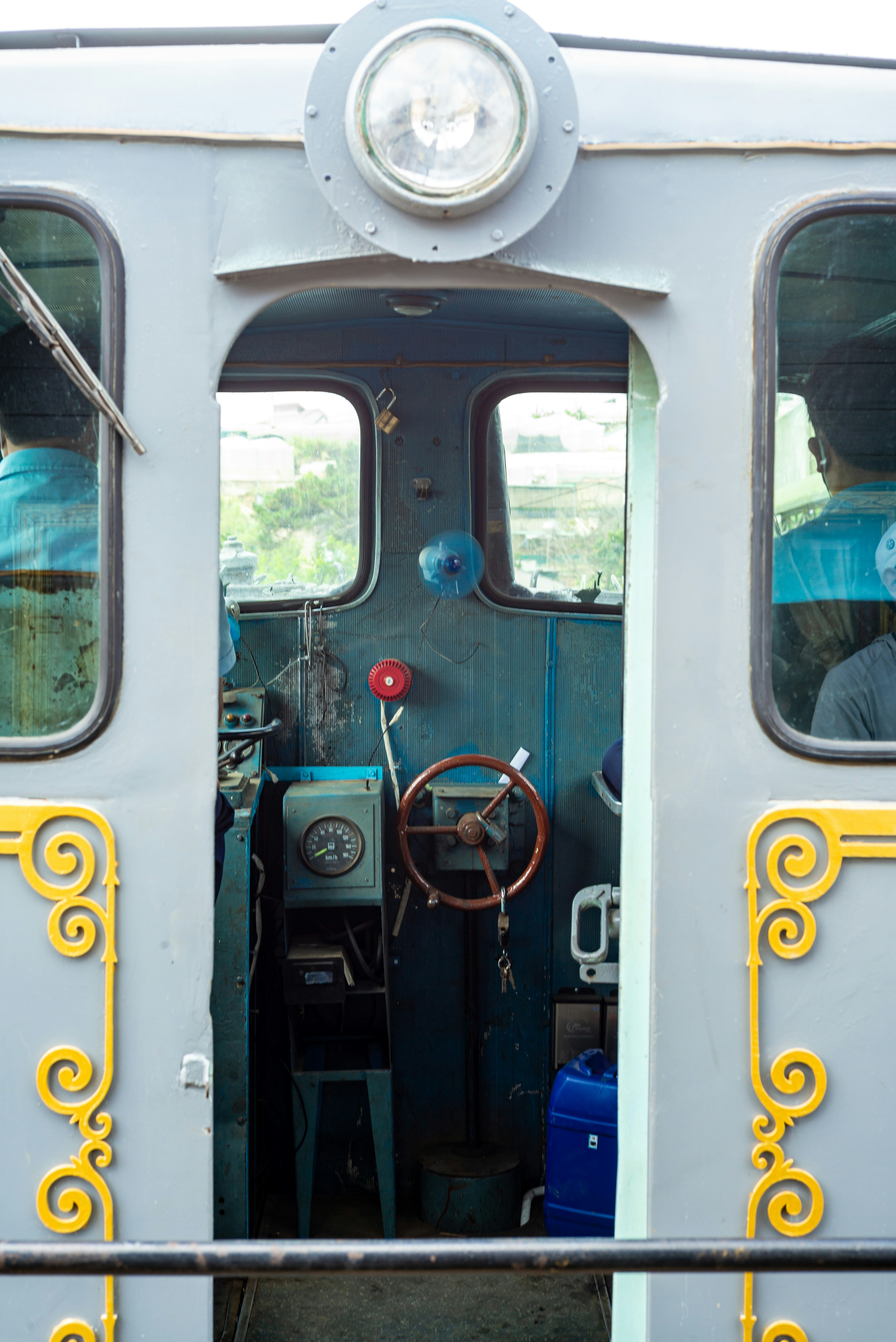 Inside of a train's cab, with equipment.