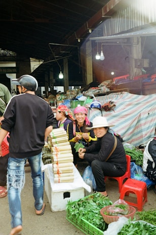 People are at a bustling outdoor market.