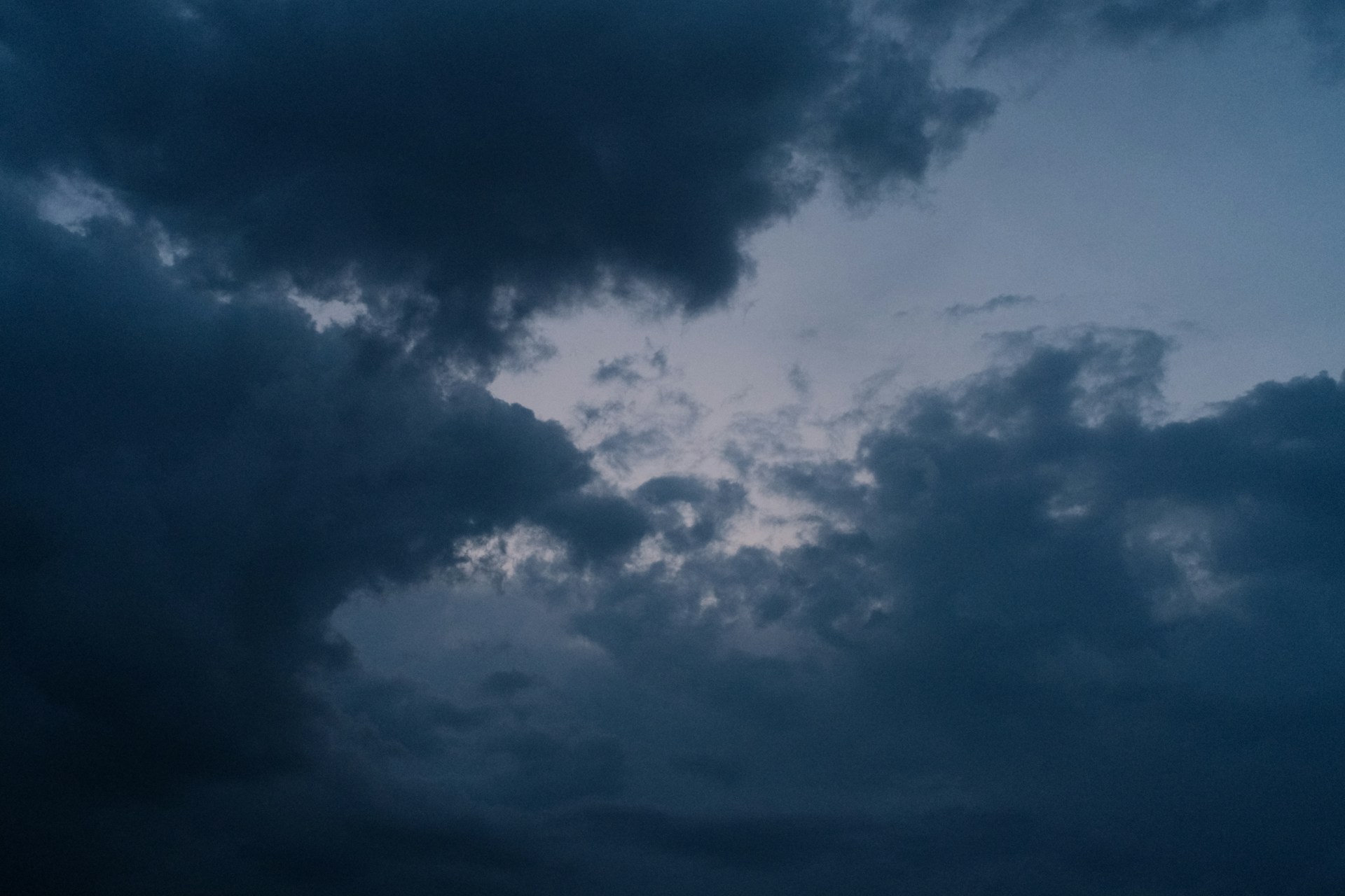 Dark, ominous clouds fill the moody sky.
