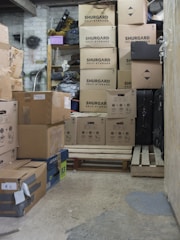 Boxes fill a dimly lit storage space.