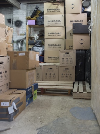 Boxes fill a dimly lit storage space.