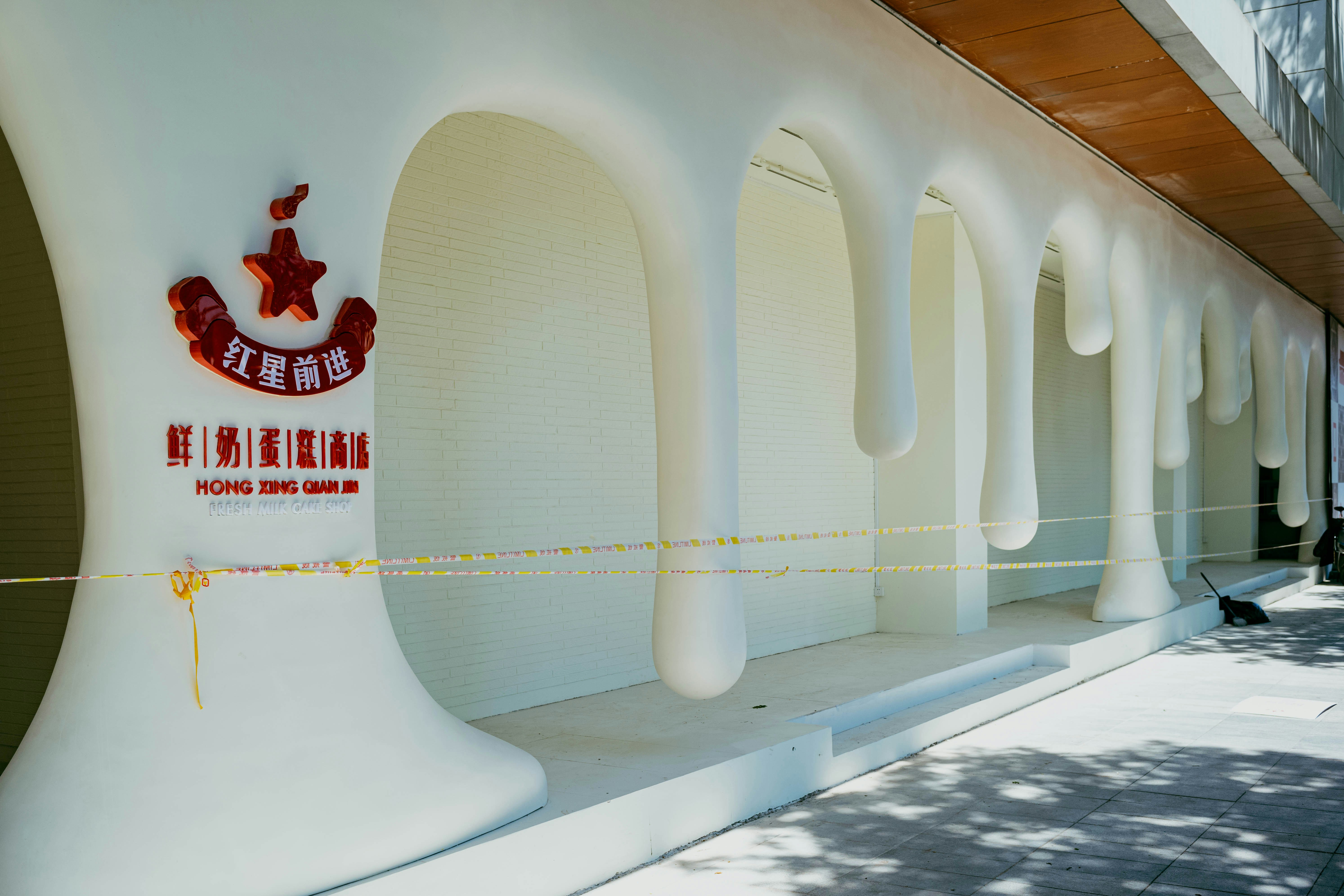 A building's exterior has a creative, drippy design.