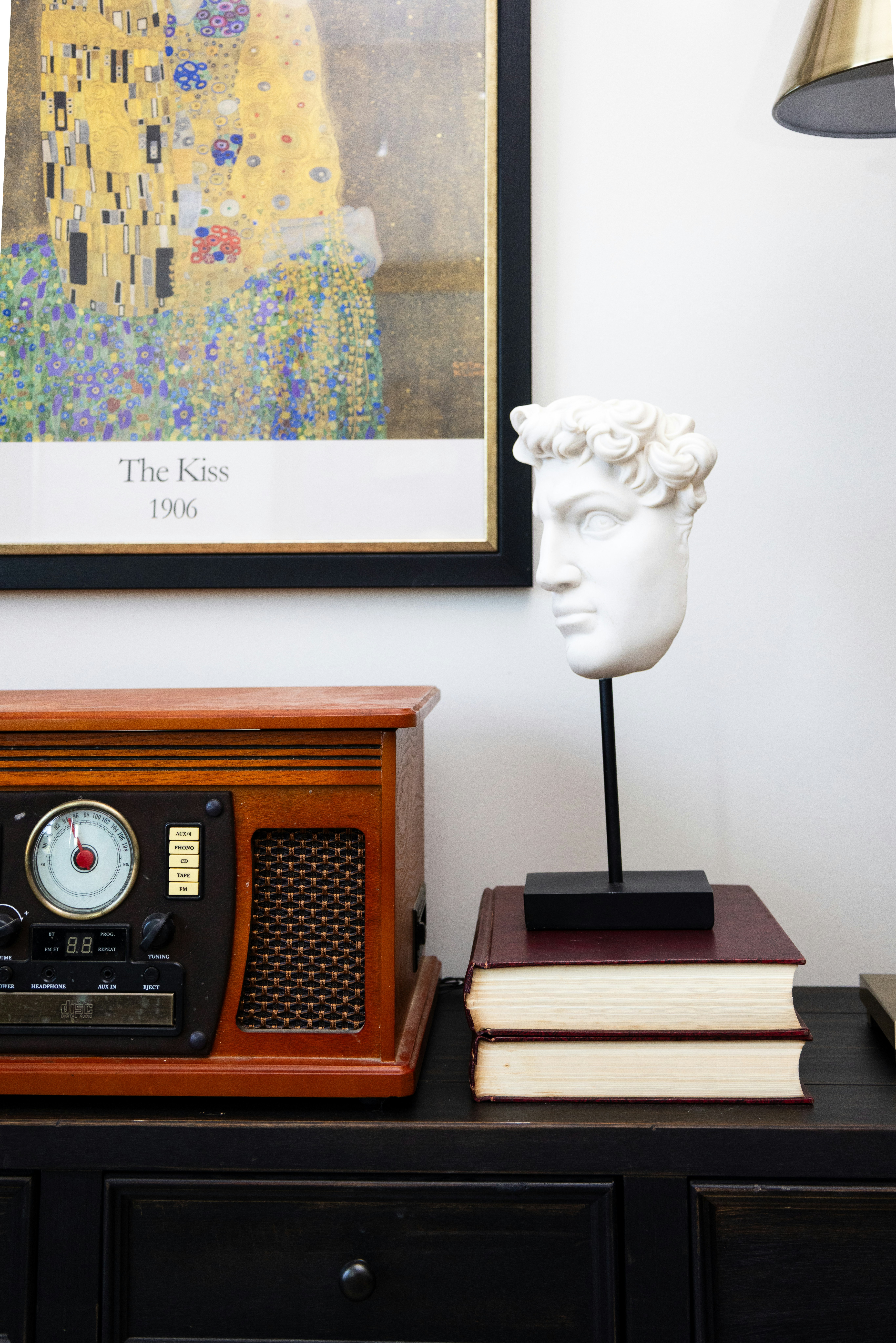 A classic statue and artwork are displayed.