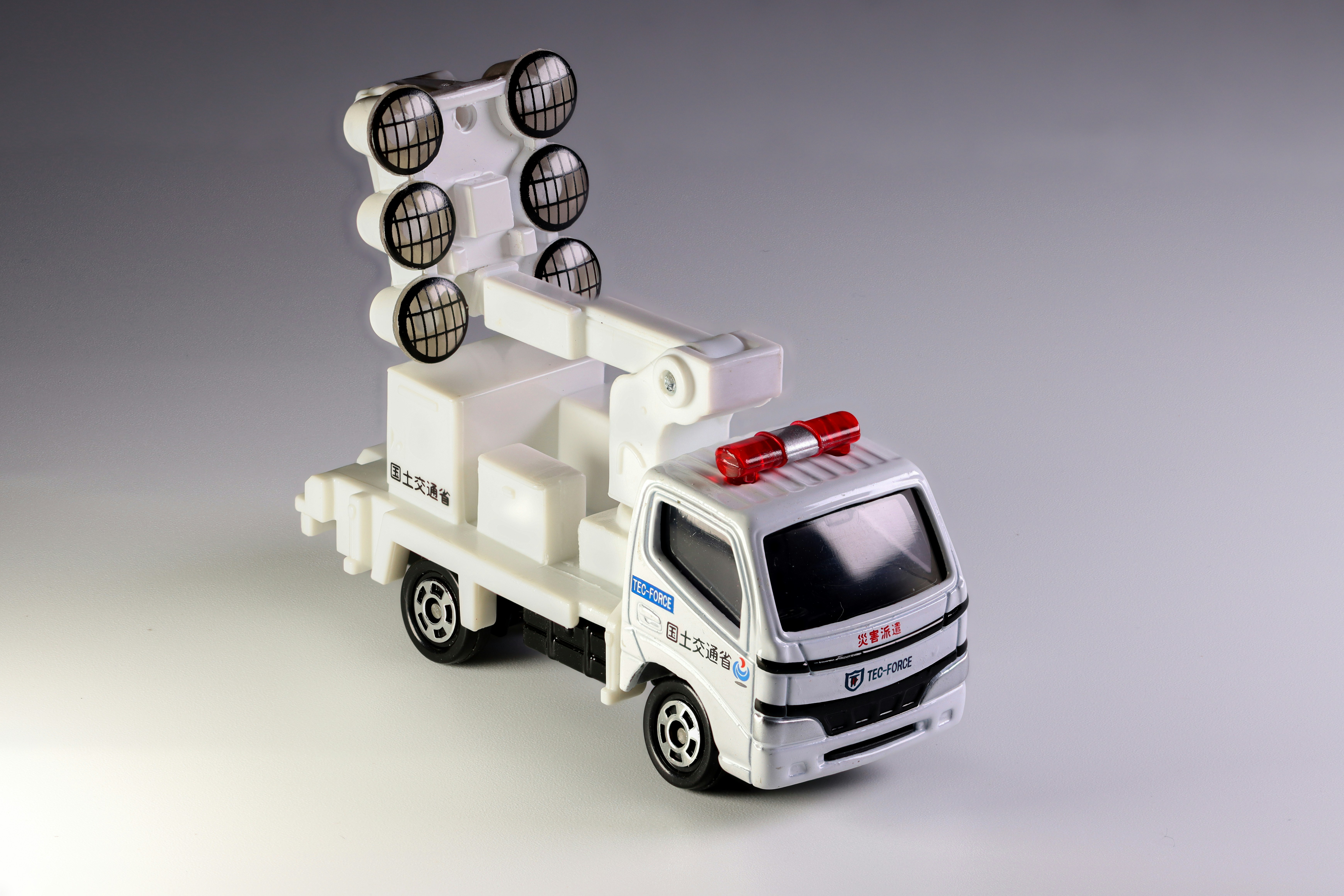 Toy truck with spotlights and a siren.