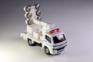 Toy truck with spotlights and a siren.