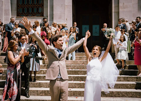 Newlyweds celebrate their wedding with joy and excitement.
