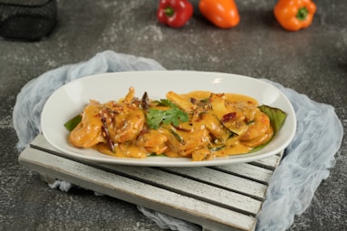 Delicious shrimp dish on a white platter.