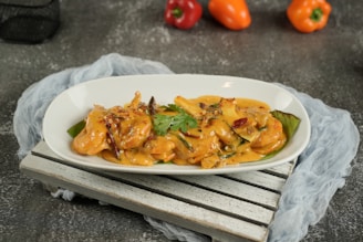 Delicious shrimp dish on a white platter.