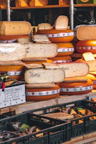 Various types of cheese are for sale.