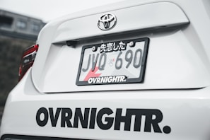 The rear of a white toyota sports car.