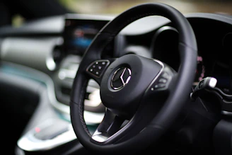 A mercedes-benz steering wheel is shown.