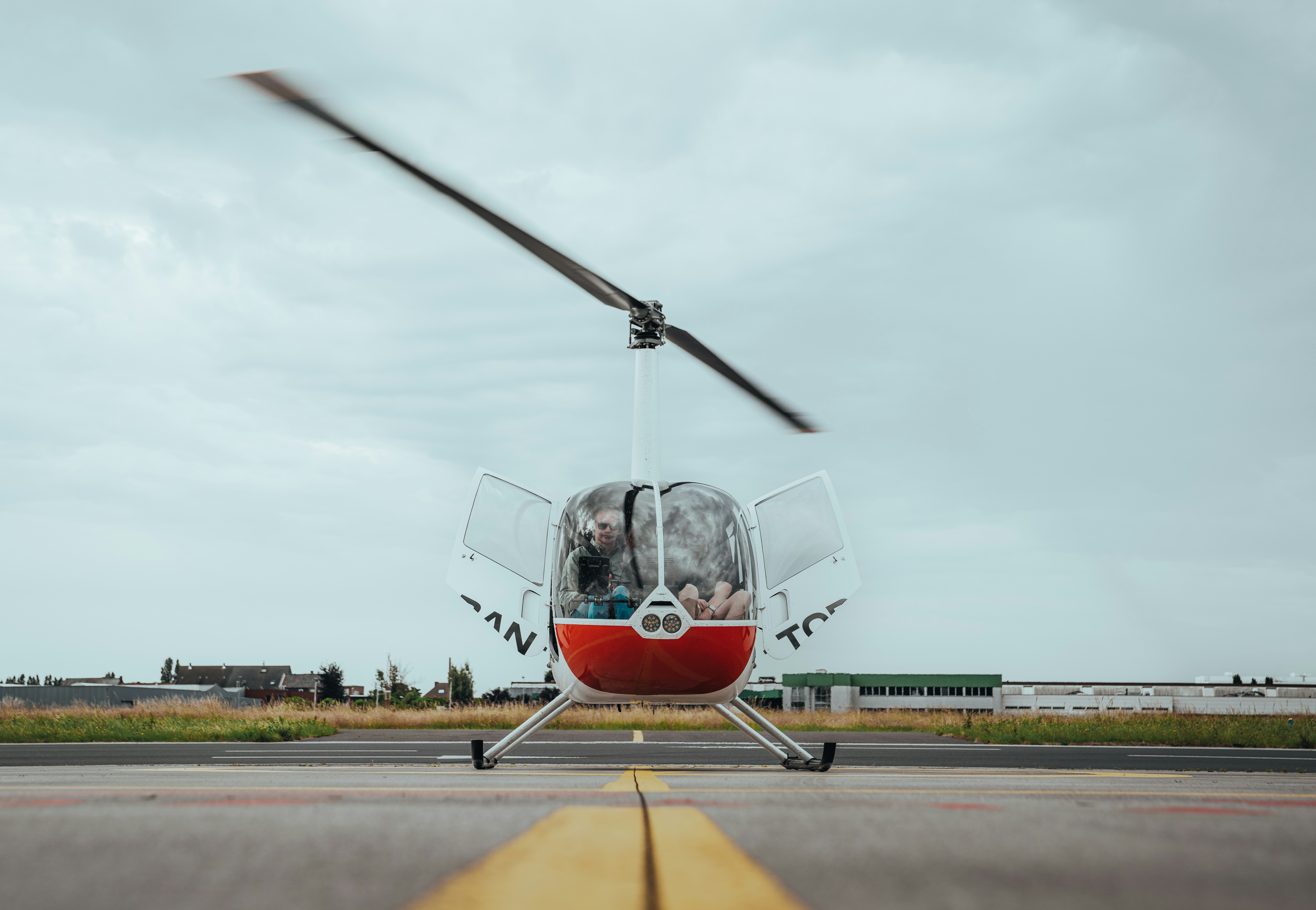 A helicopter on the tarmac, ready for flight.