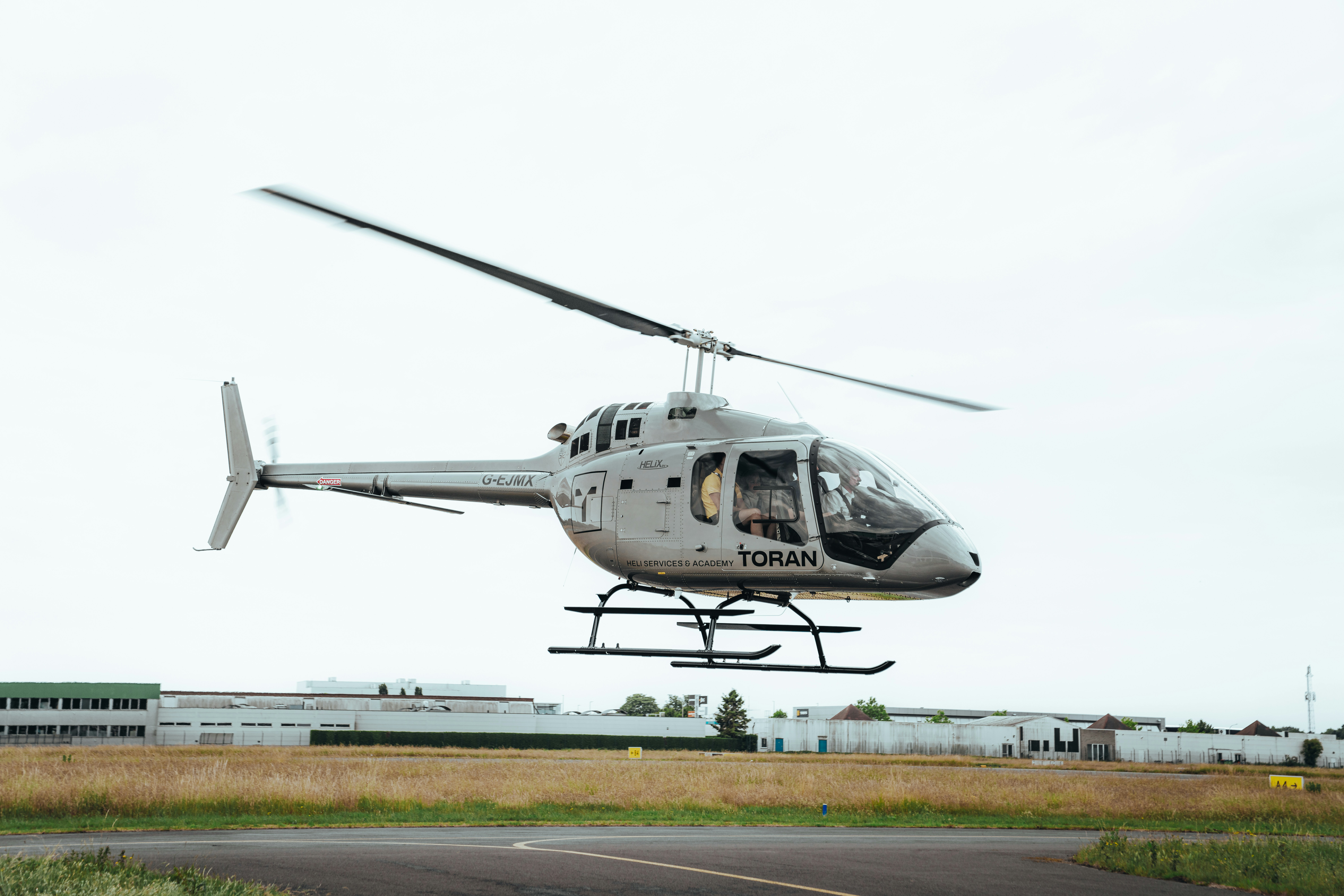 A helicopter is taking off into the air.
