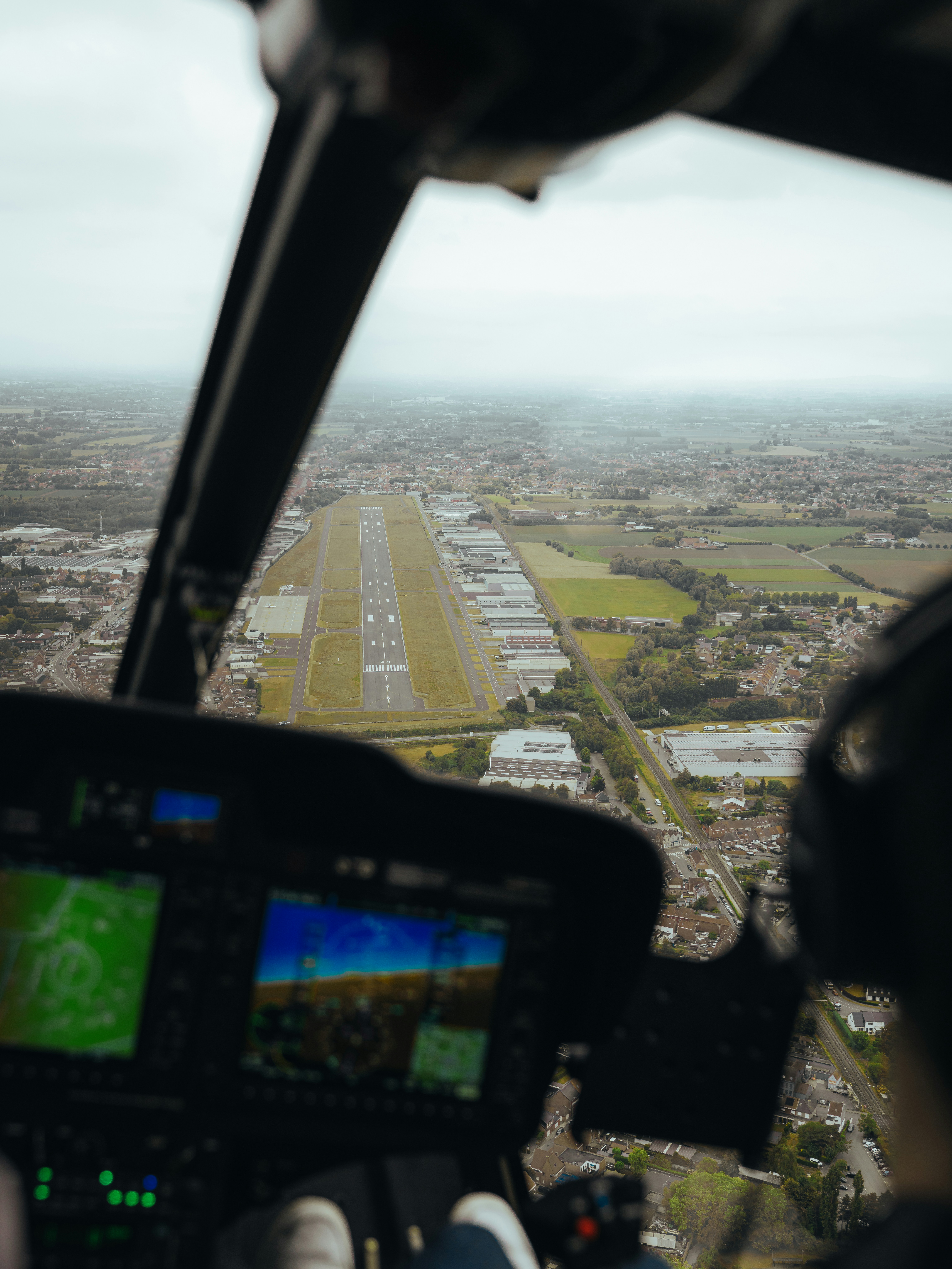Helicopter view of an airfield during flight.
