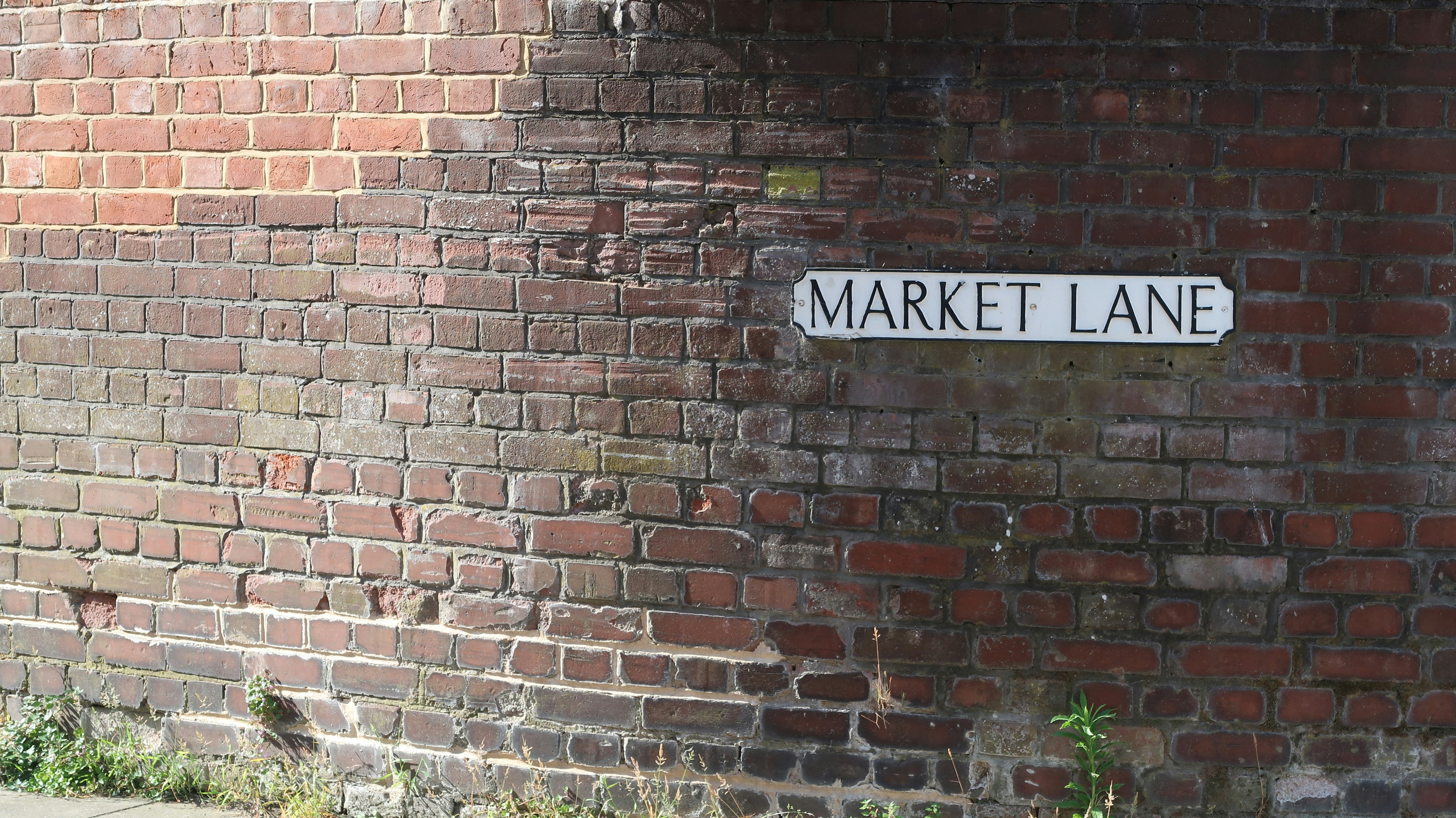 Petticoat Lane Market signage and bustling street stalls - ethnic clothing markets solo