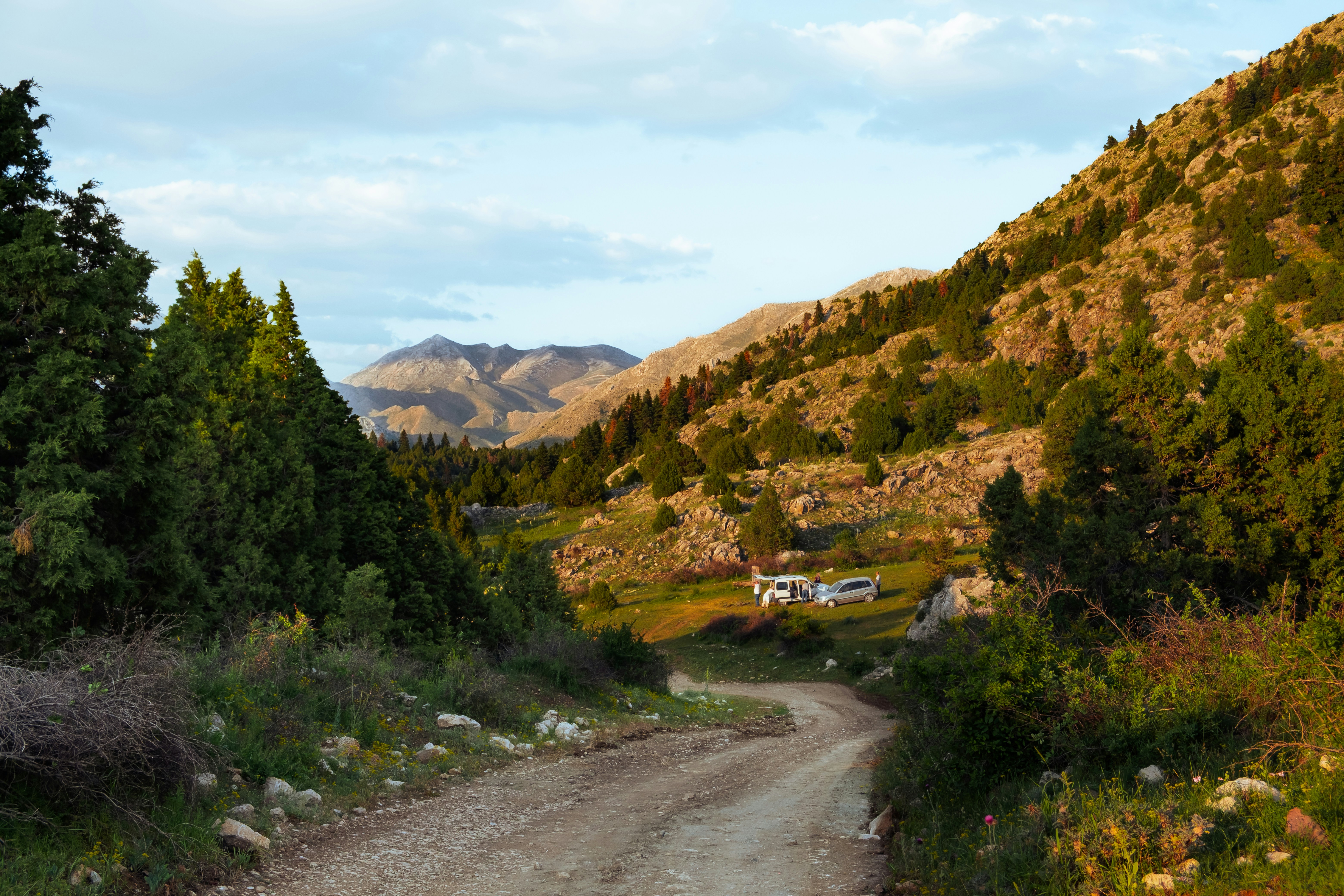 A winding road leads through mountains.