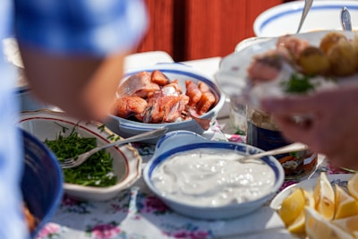 Food and sauces are served on a table.