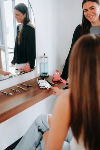 A customer pays at a hair salon.