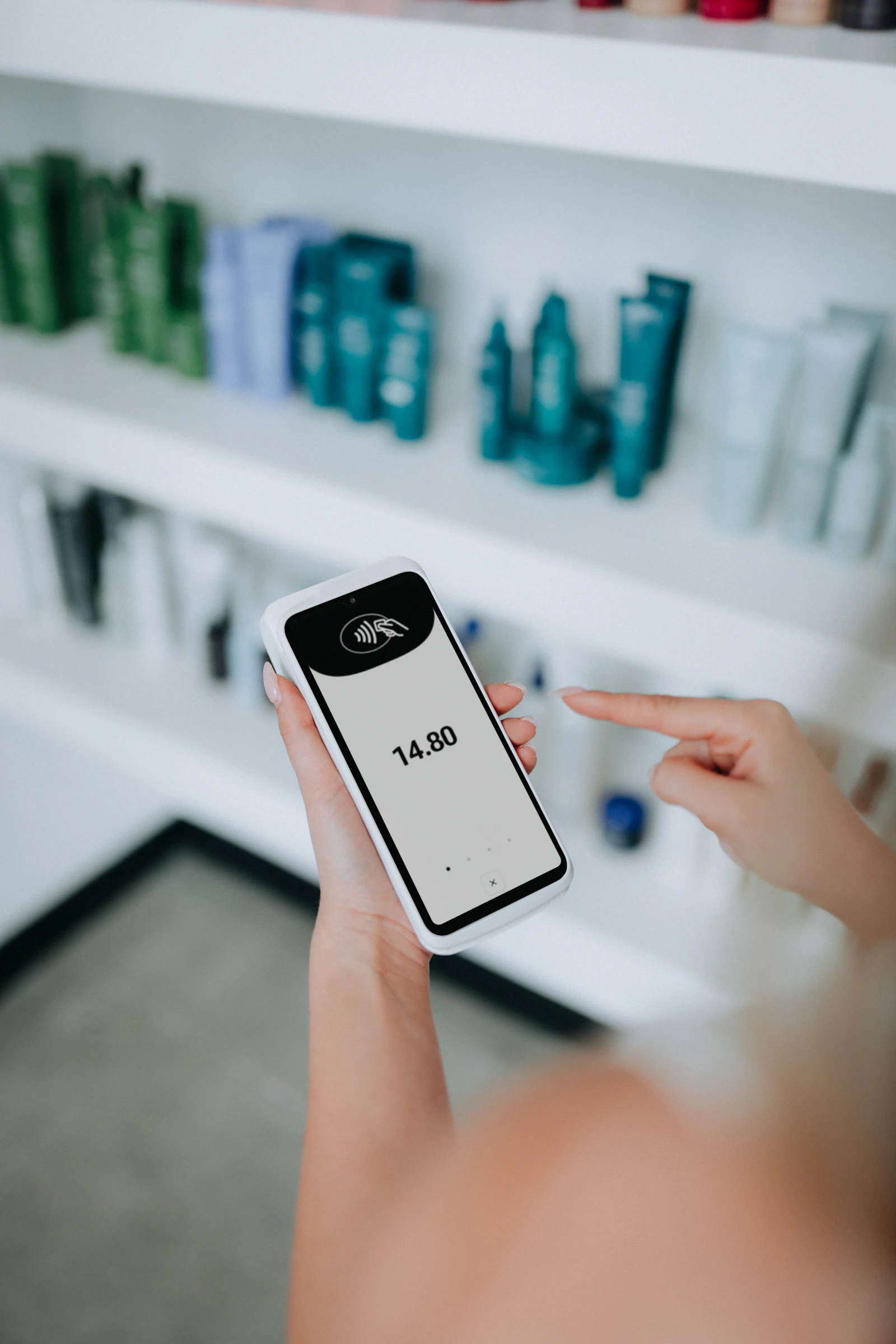 Handheld payment terminal showing a clear total