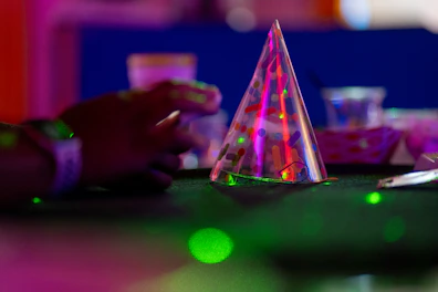 A party hat sits in the party's midst.