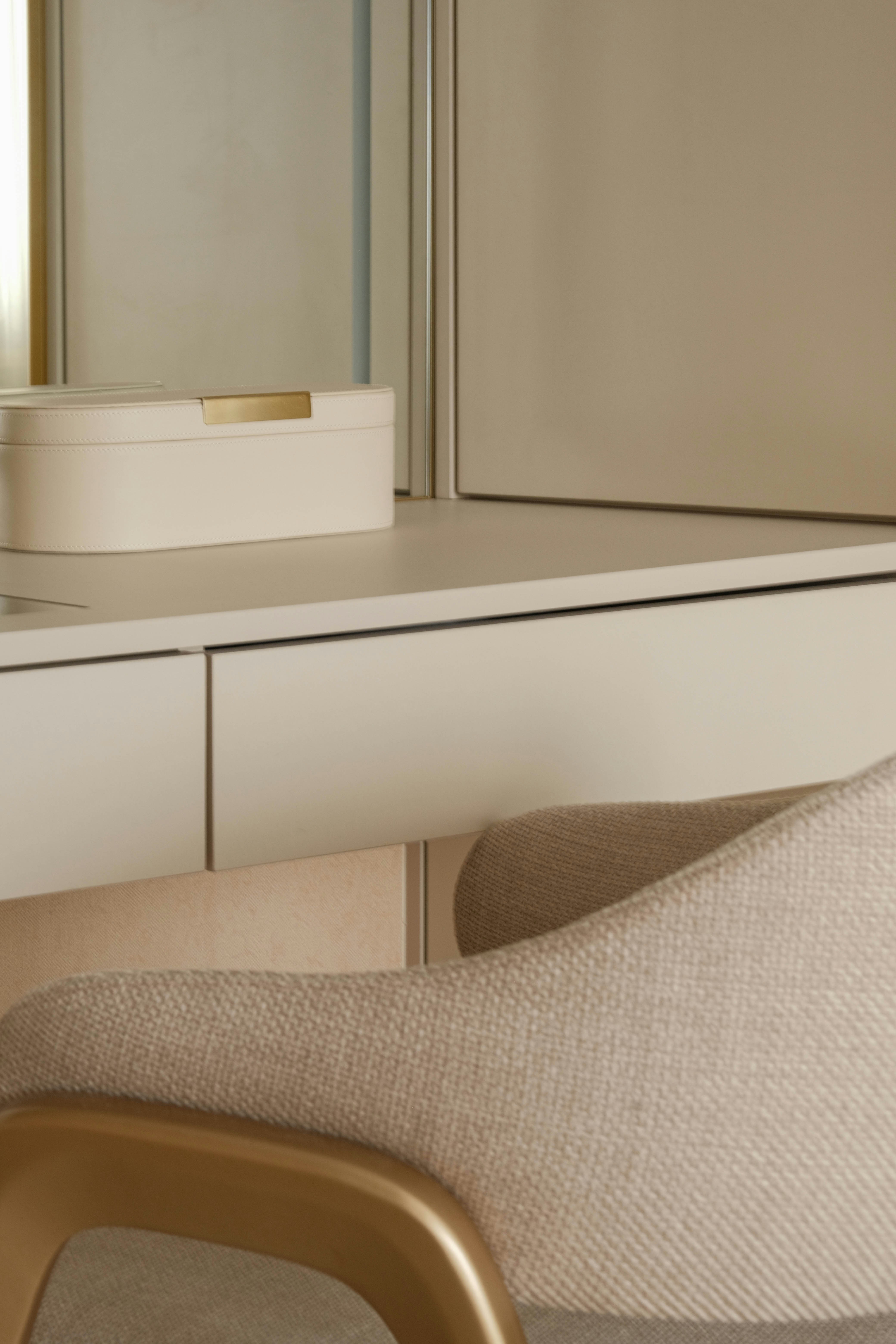 A cozy dressing table with neutral tones.