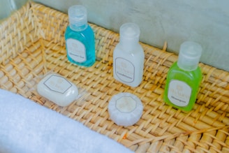 Bath products are neatly arranged in a woven basket.
