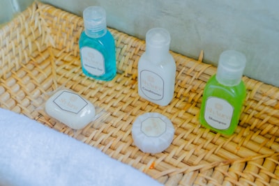 Bath products are neatly arranged in a woven basket.