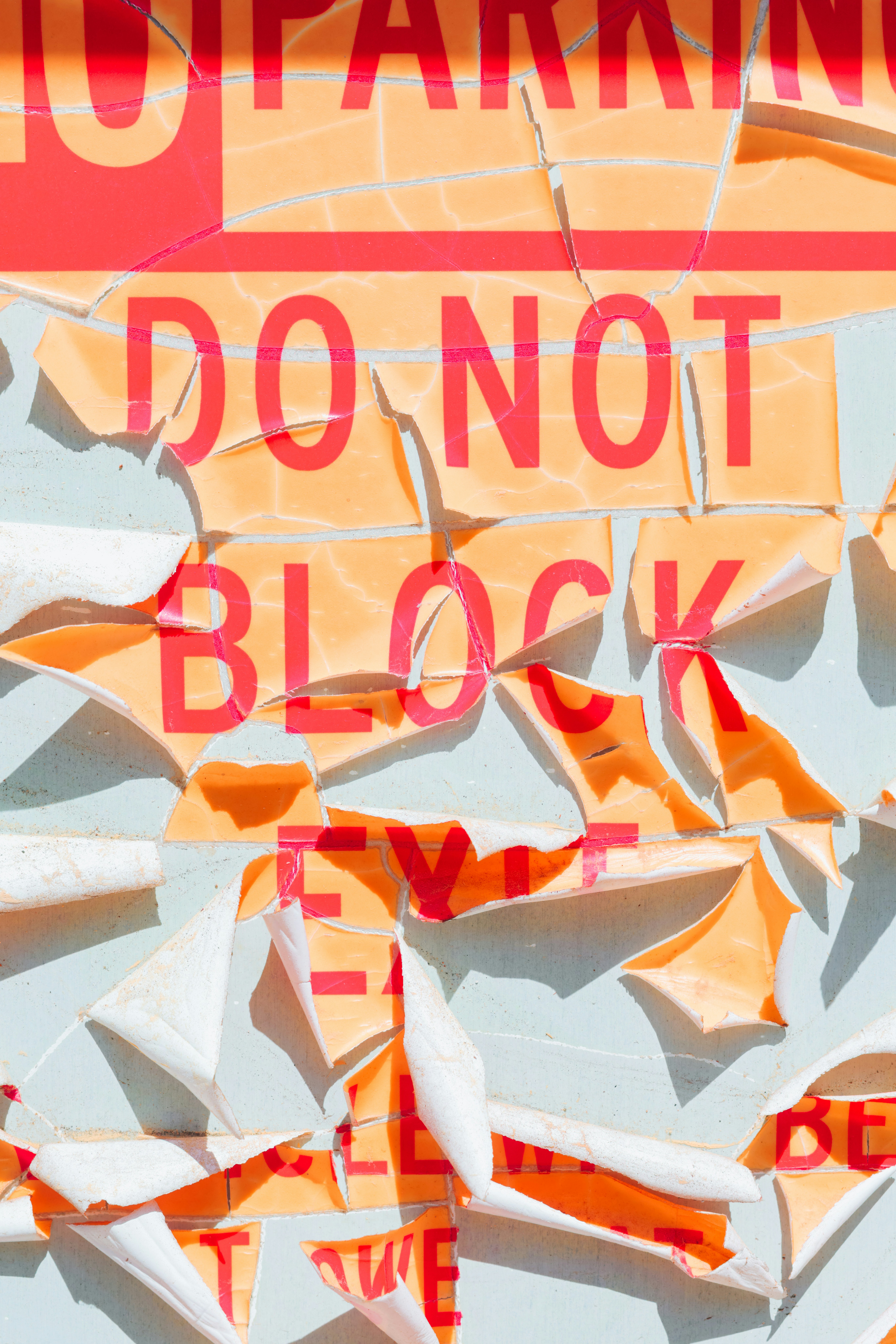 Do not block, a warning torn and faded.