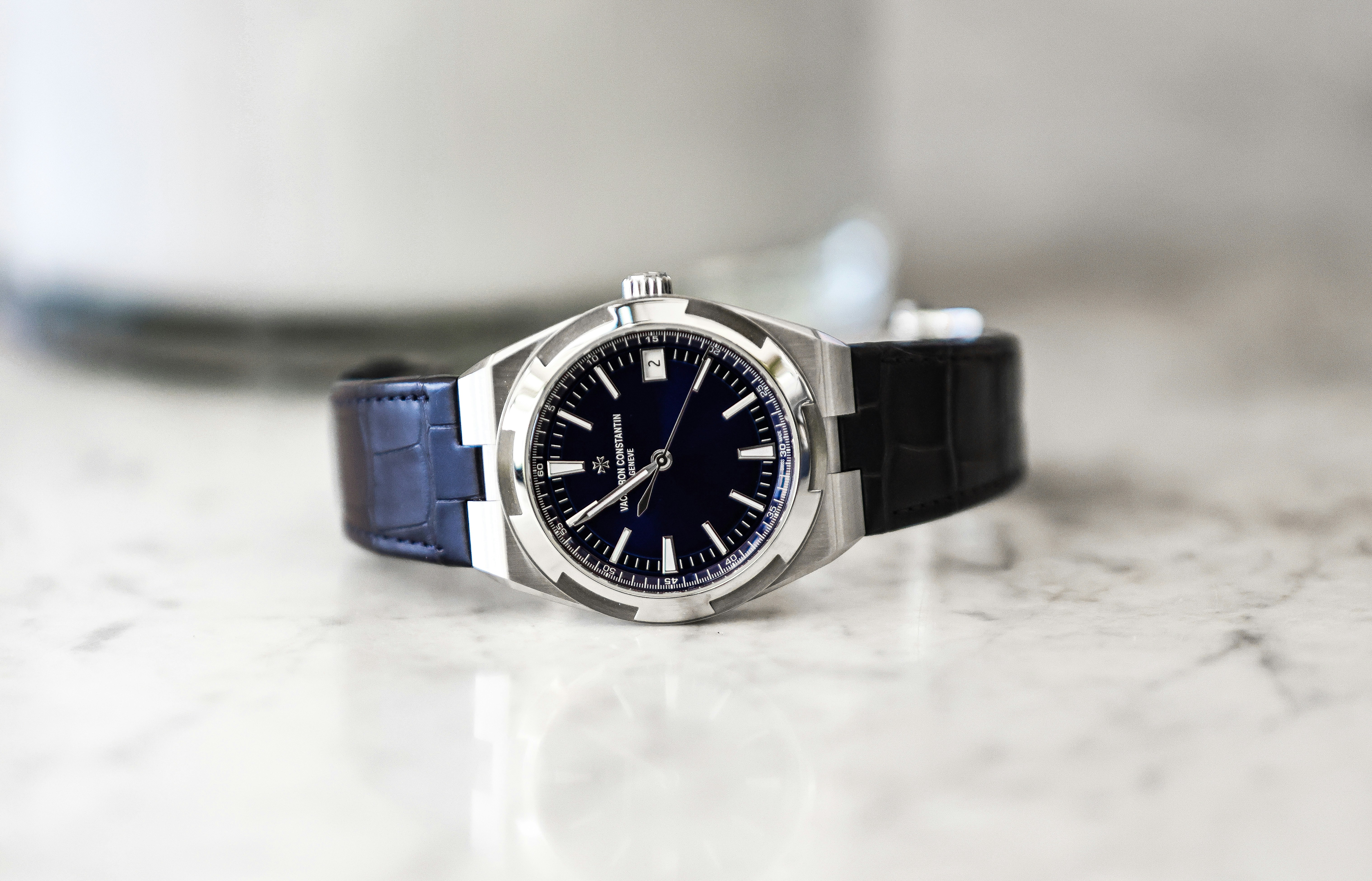 A stylish wristwatch with a dark face.