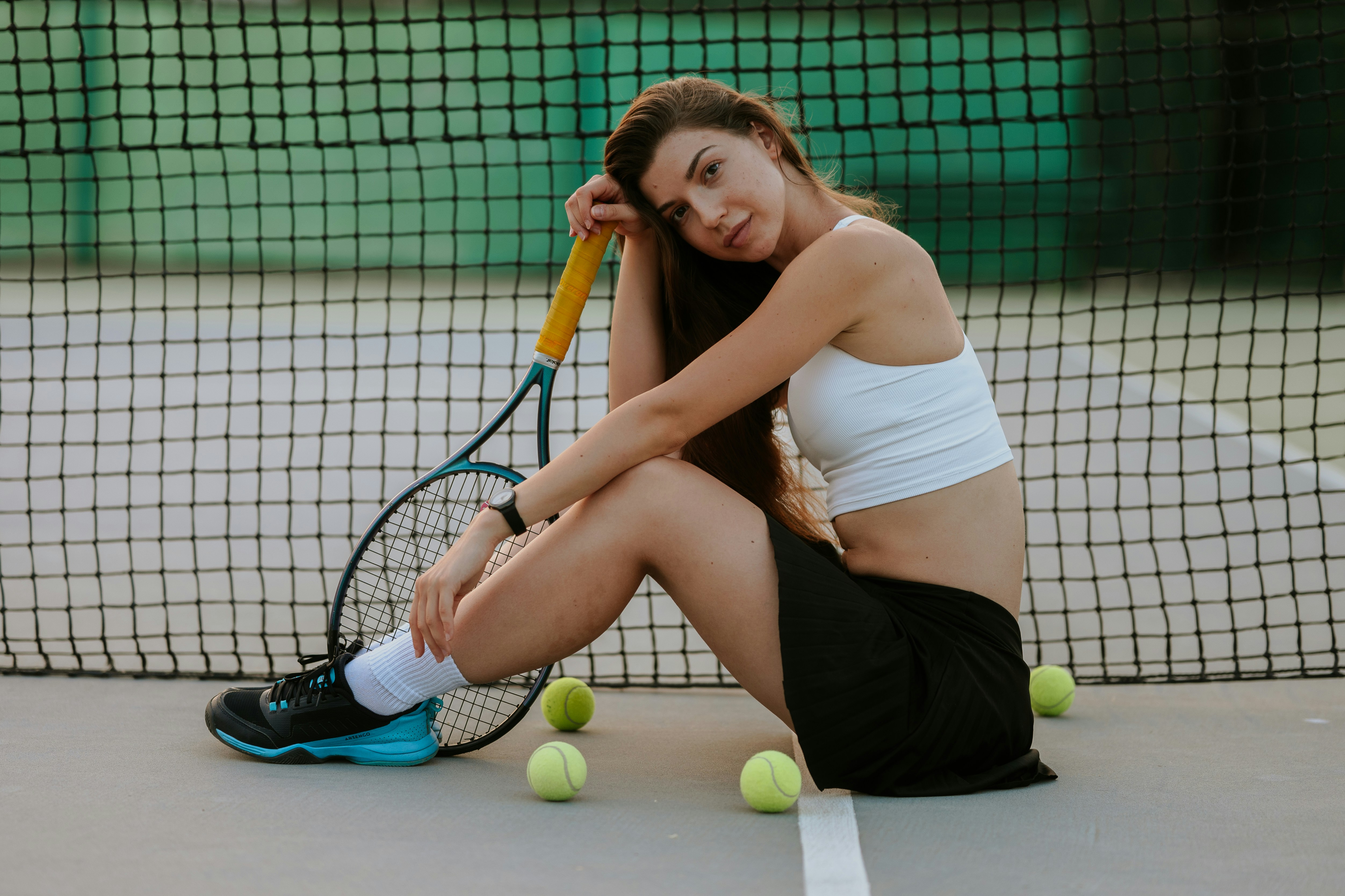 Tired tennis player resting