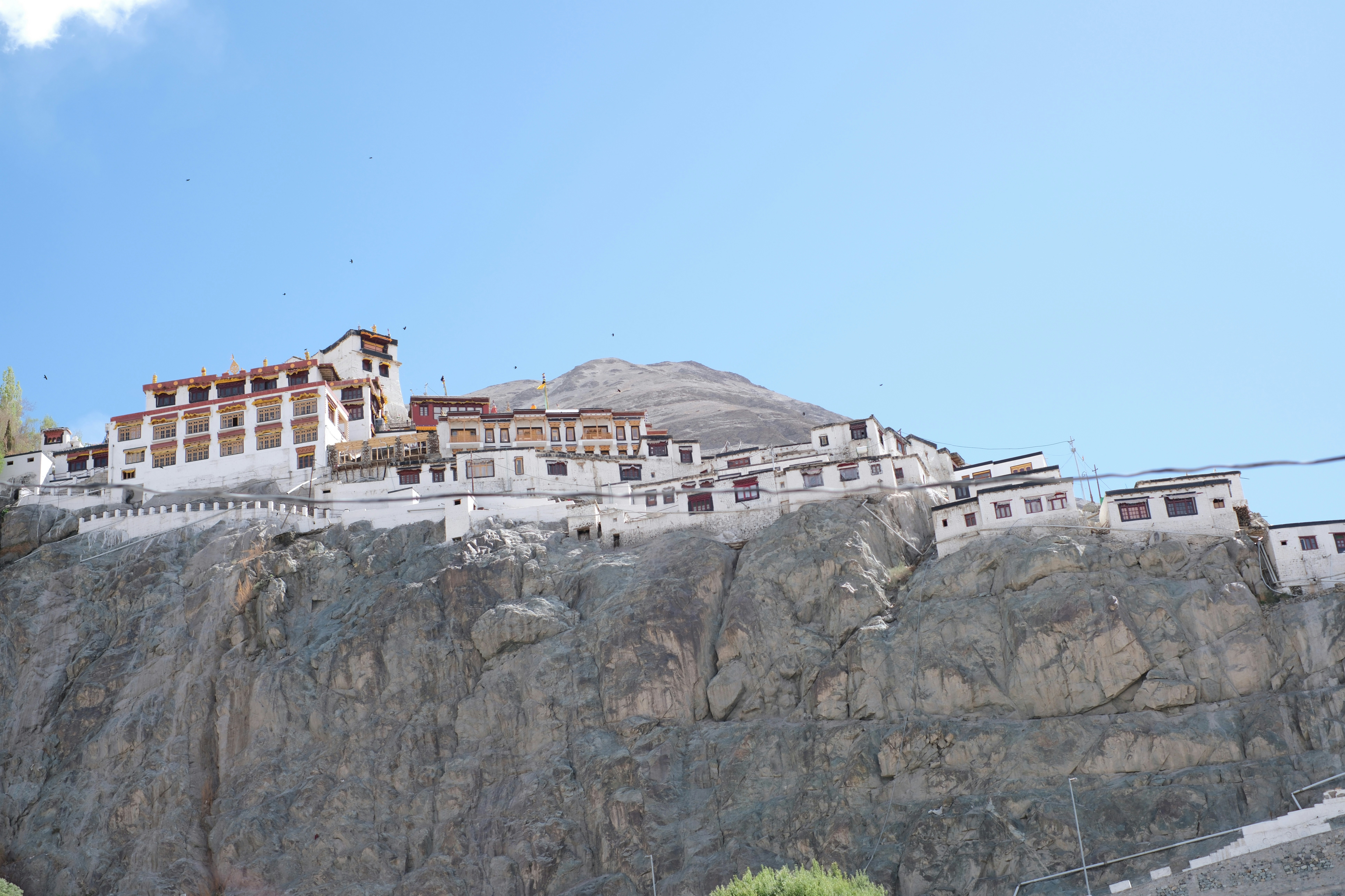 A monastery perched on a rocky hillside.