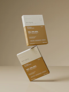 Two anti-aging product boxes are suspended in mid-air.