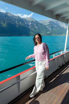Woman smiles while enjoying a boat ride